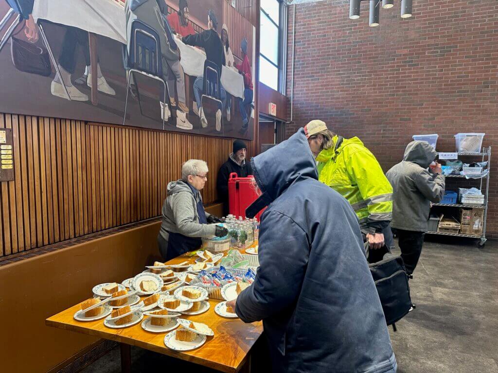 Serving a meal at Community Soup Kitchen New Haven